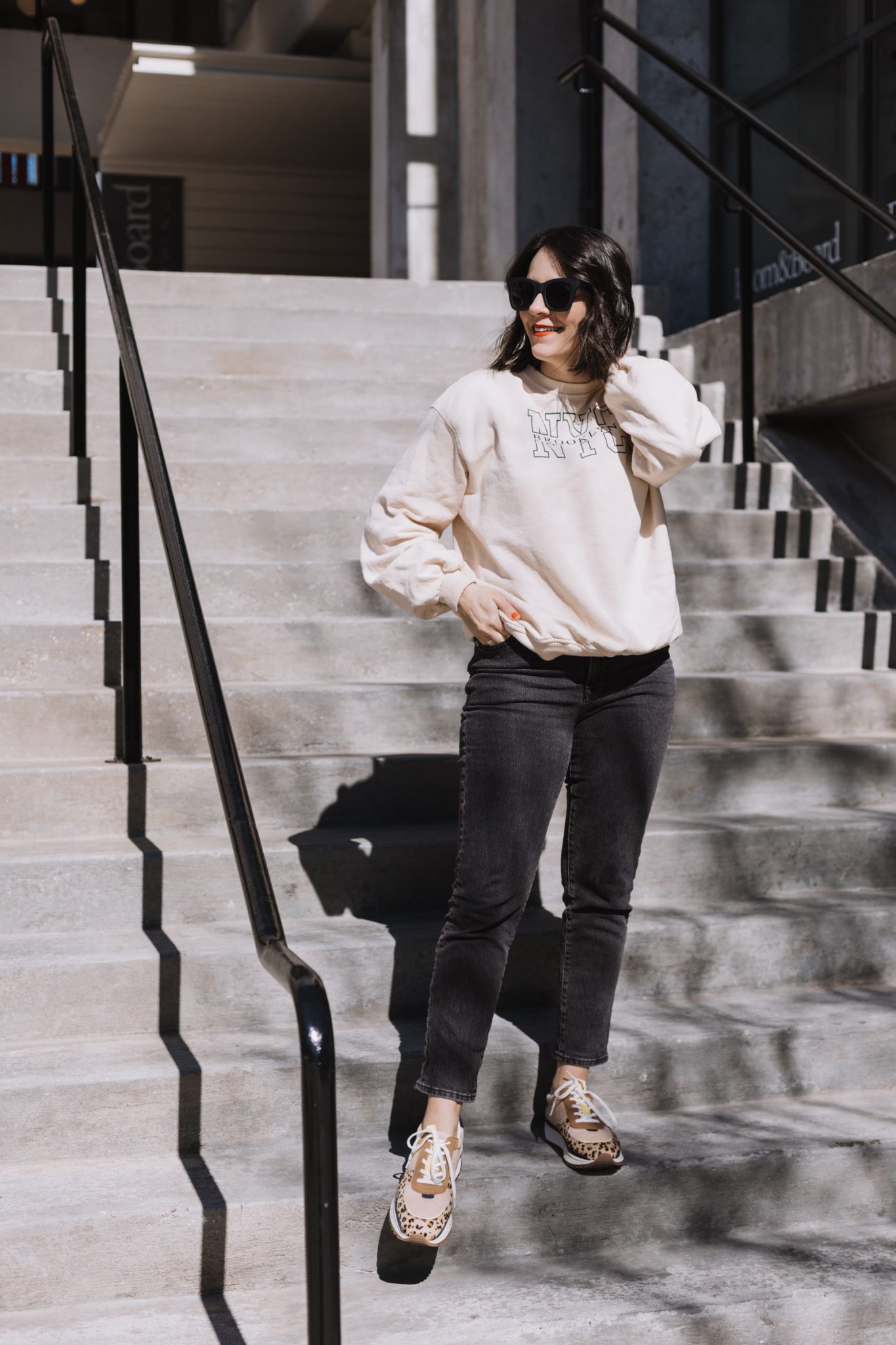 black straight leg jeans and a sweatshirt